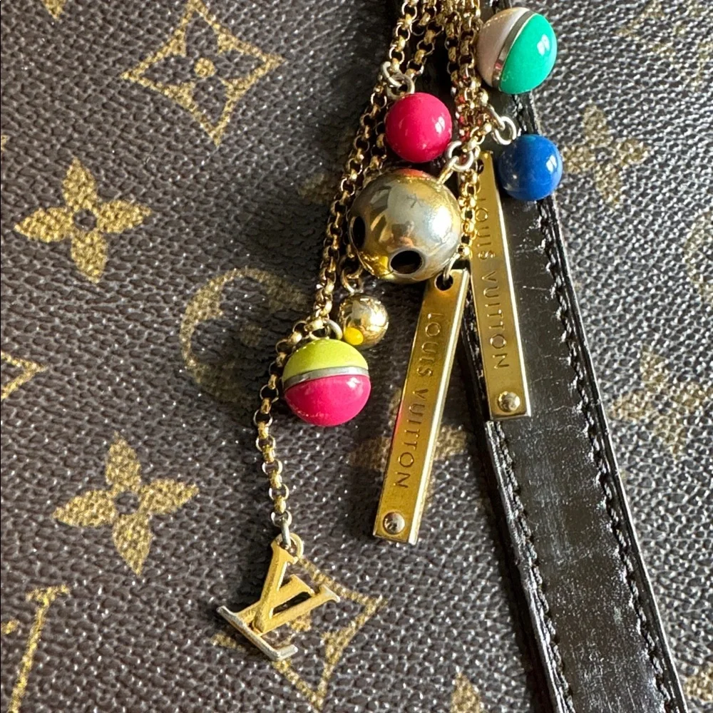 Authentic Louis Vuitton Porte Cles grelots bag charm and key holder